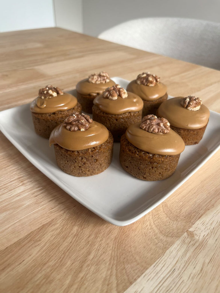 Coffee Financiers topped with coffee glaze and walnuts