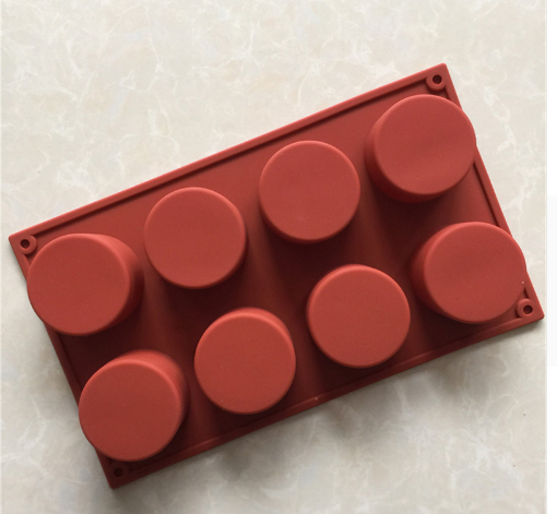 Butter and Bright Cylinder Tube six cavity Mould in terracotta red shade against neutral background.